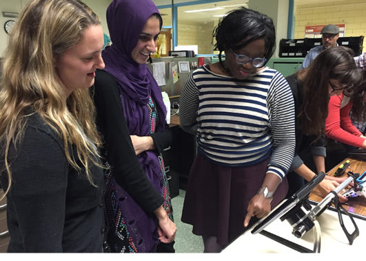 Three students at the UIC assistive technology unit