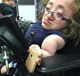Lauren placed cell phone in phone holder that is attached to her wheelchair