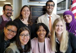 8 Illinois LEND faculty and trainees together in front of Senator Tammy Duckworth’s office sign in DC
