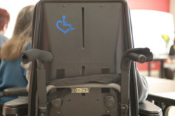 The back of a wheelchair which displays a 3ELOVE.com sticker