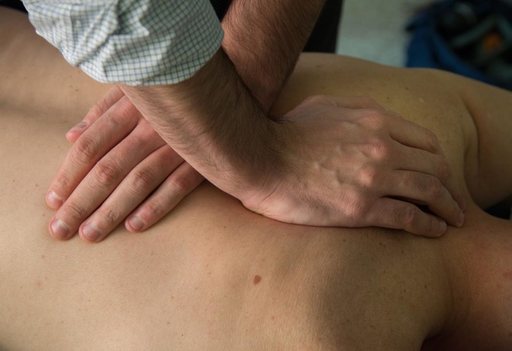 Man getting his back massaged